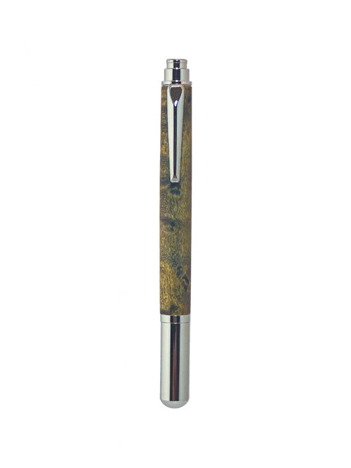 A handcrafted Pen & Ink rollerball pen made from blue-tinted birds eye maple, finished with polished chrome accents. Subtle shimmer, rare grain, and a story in every swirl.