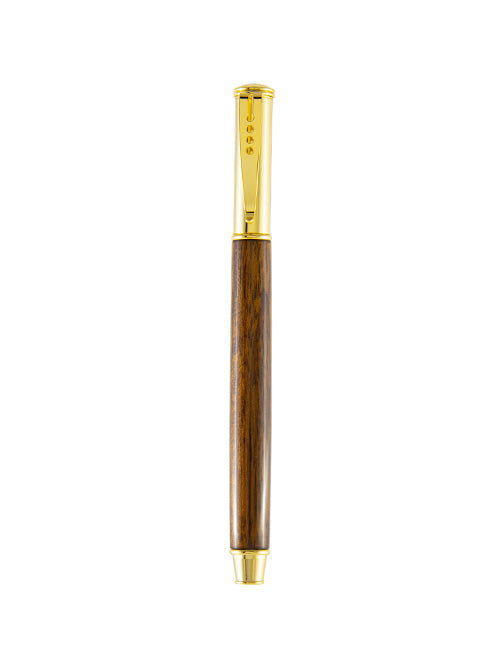 This Pen & Ink snap cap pen features smooth, chocolate-toned Shedua wood with subtle grain patterns, accented by polished gold hardware — a warm classic with quiet charm.